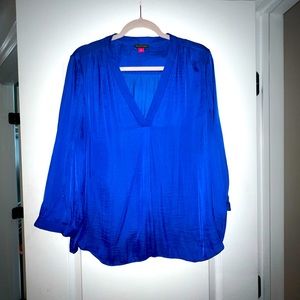 Beautiful blue Vince Camuto satin long sleeve top. Flowy fabric. Button at wrist
